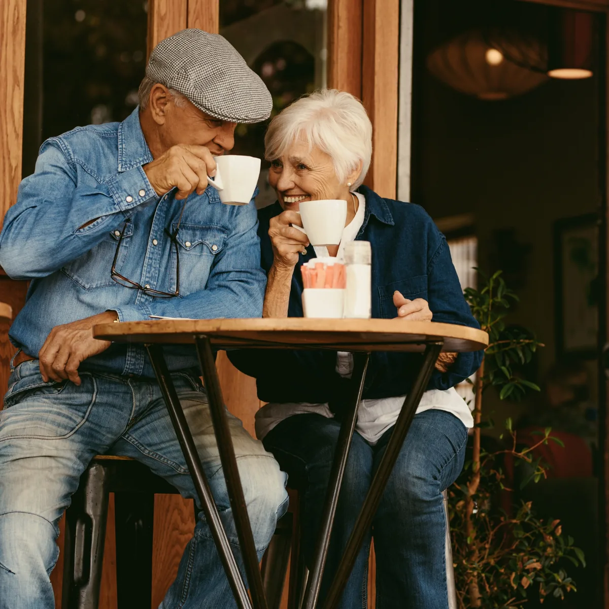 An older couple sharing coffee together at a cafe